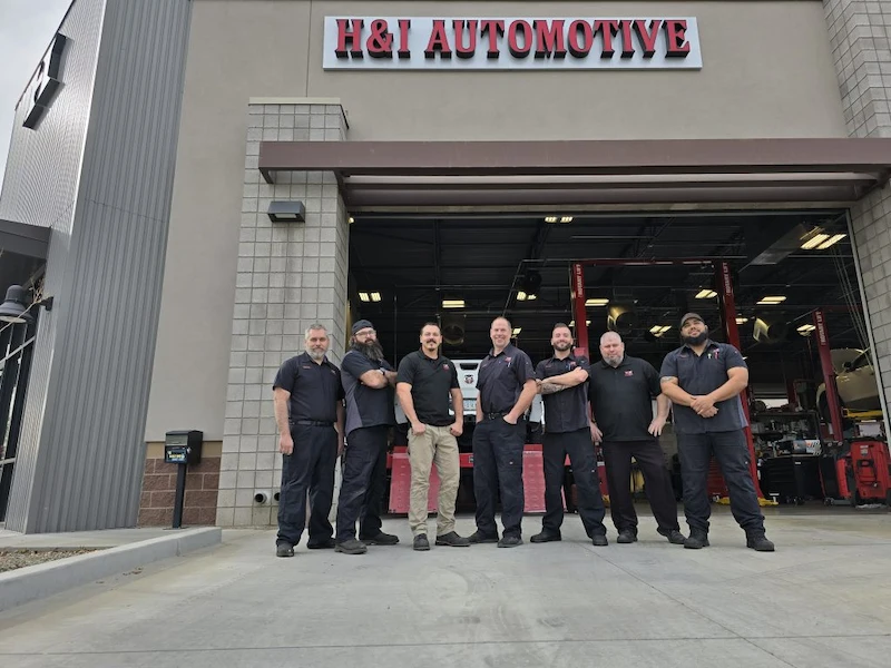 h&i automotive team in front of store